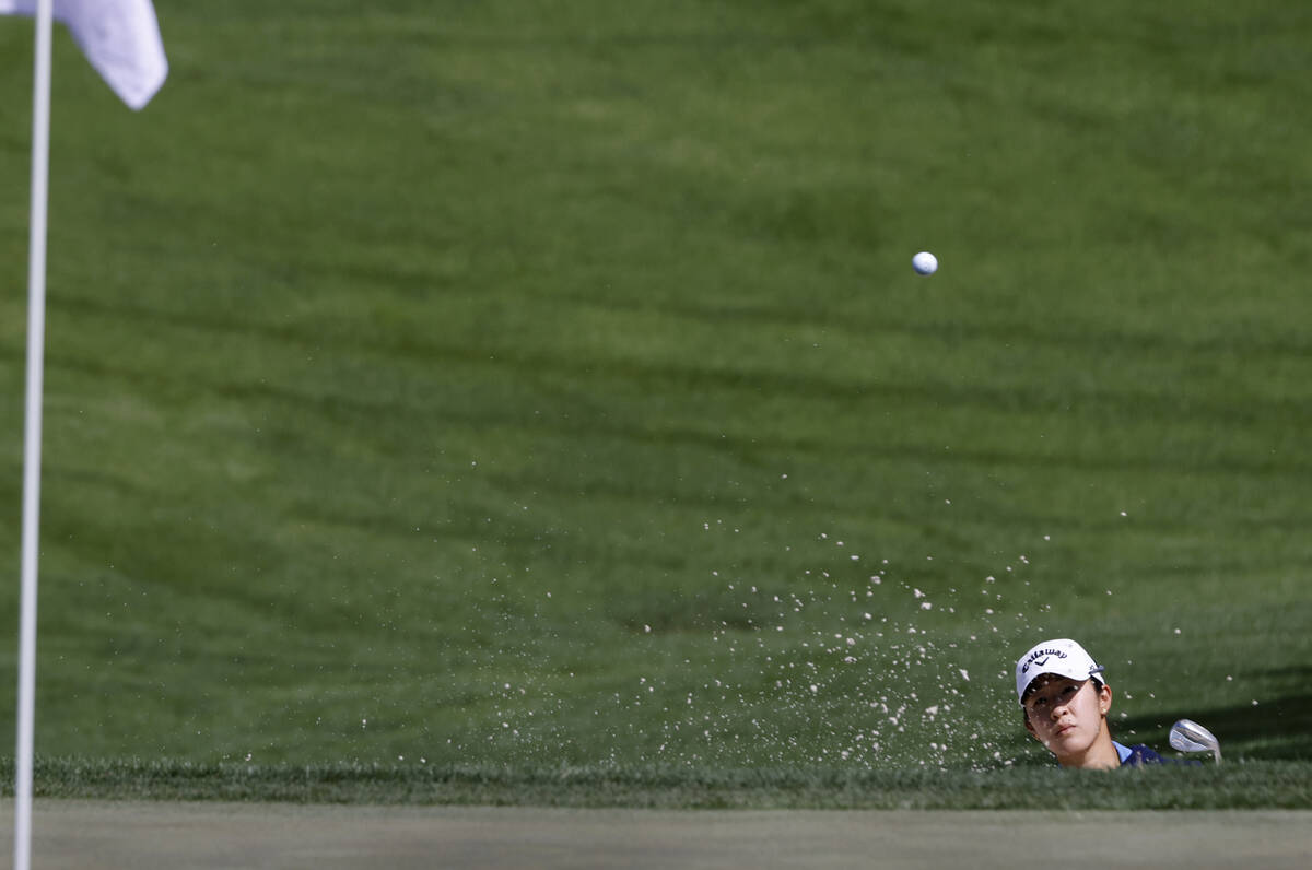 Andrea Lee of the USA chips out of the sand to the second green during the second round of the ...