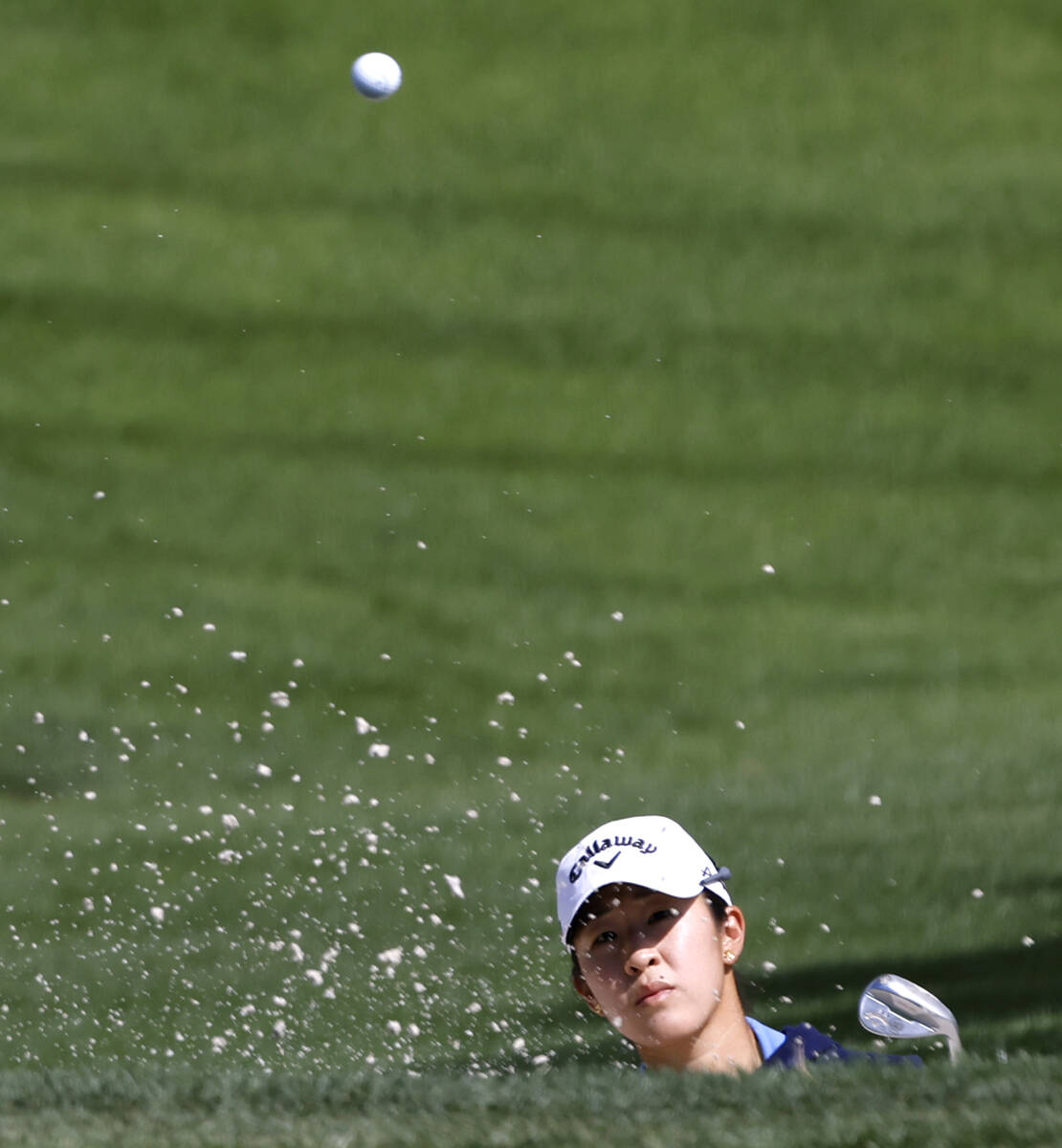 Andrea Lee of the USA chips out of the sand to the second green during the second round of the ...