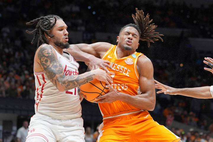 Houston's Emanuel Sharp, left, steals the ball from Tennessee's Chaz Lanier during the second h ...