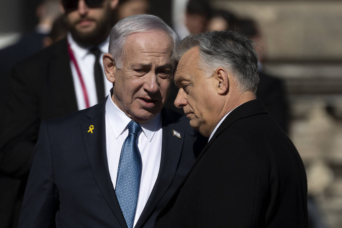 Israeli Prime Minister Benjamin Netanyahu, left, and Hungarian Prime Minister Viktor Orban, rig ...