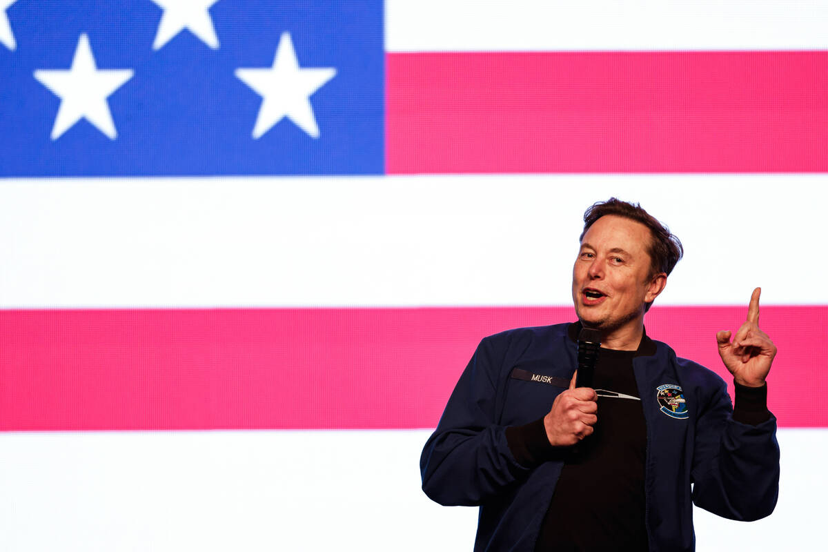 Elon Musk speaks at a town hall Sunday, March 30, 2025, in Green Bay, Wis. (AP Photo/Jeffrey Ph ...