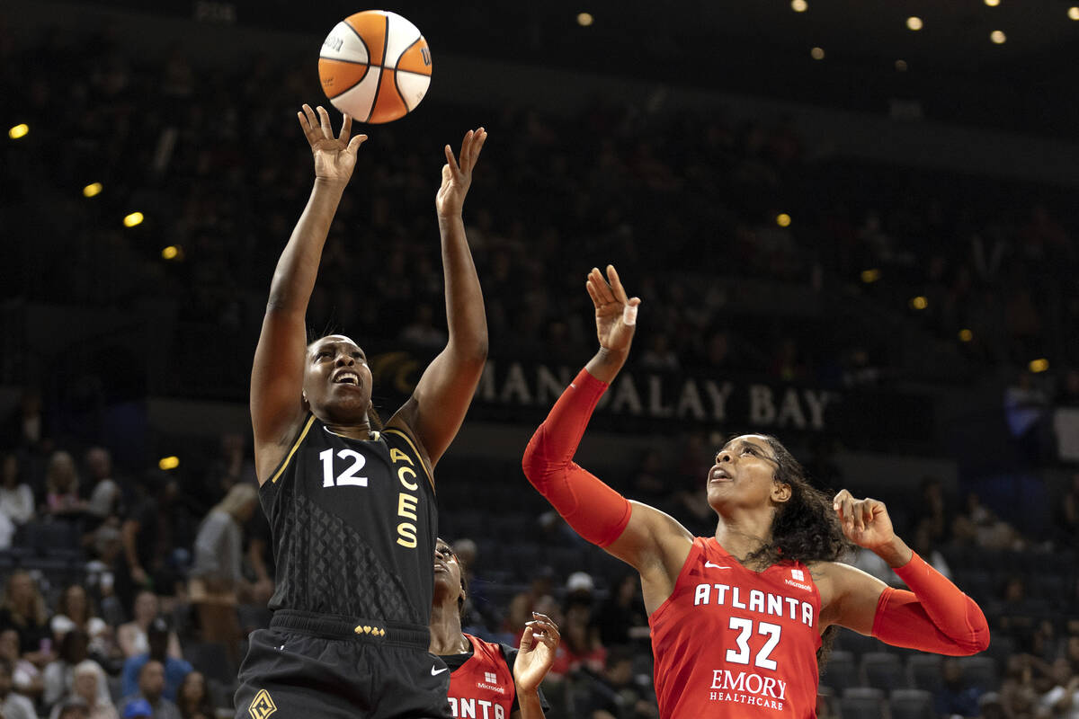 Las Vegas Aces guard Chelsea Gray (12) shoots against Atlanta Dream forward Cheyenne Parker (32 ...