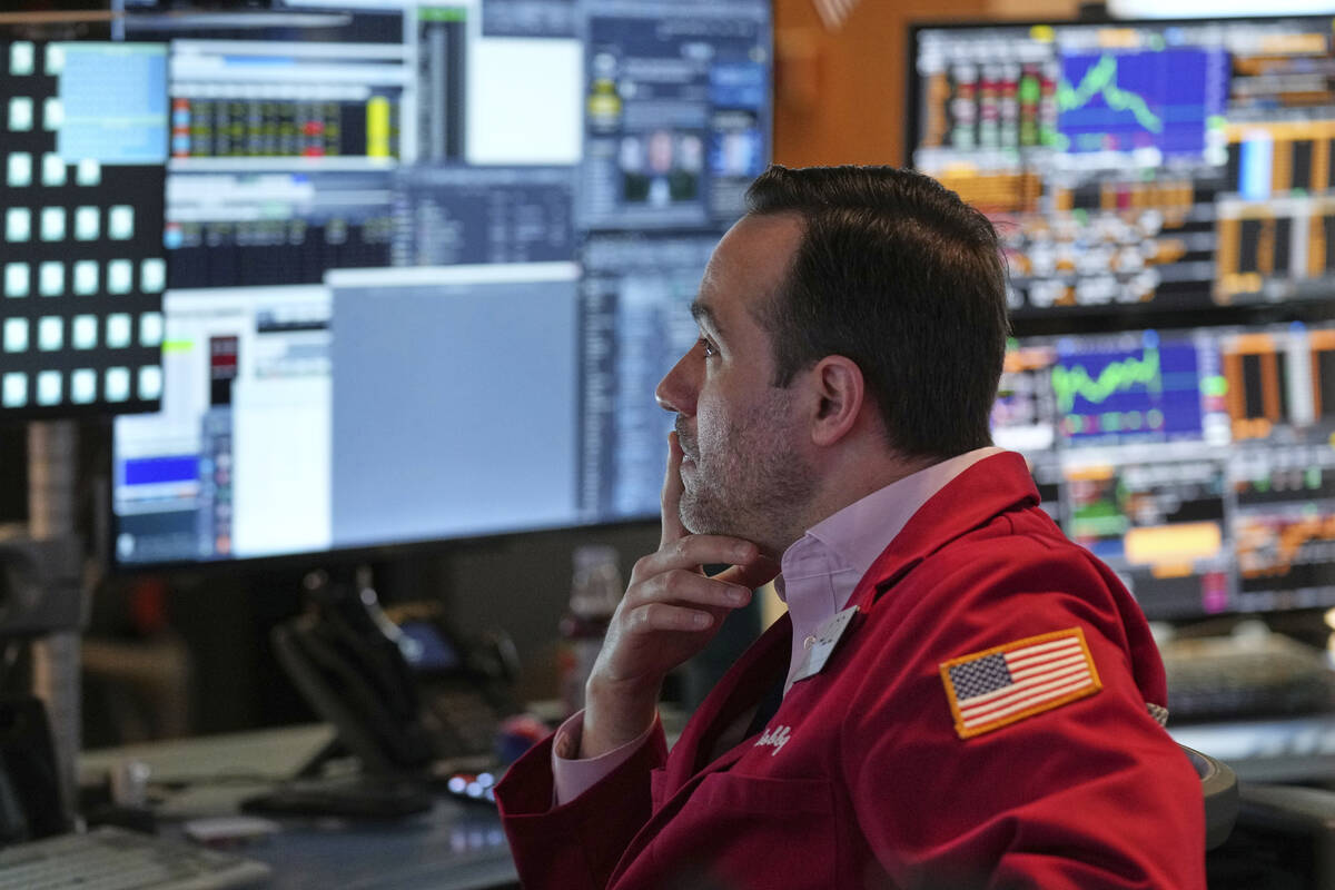 Robert Greason works on the floor at the New York Stock Exchange in New York, Thursday, April 3 ...