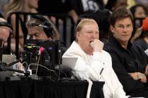 Las Vegas Aces owner Mark Davis, left, sits next to former NFL star Tom Brady at an Aces game a ...