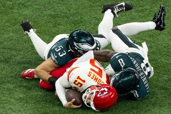 Kansas City Chiefs quarterback Patrick Mahomes (15) is tackled by Philadelphia Eagles linebacke ...