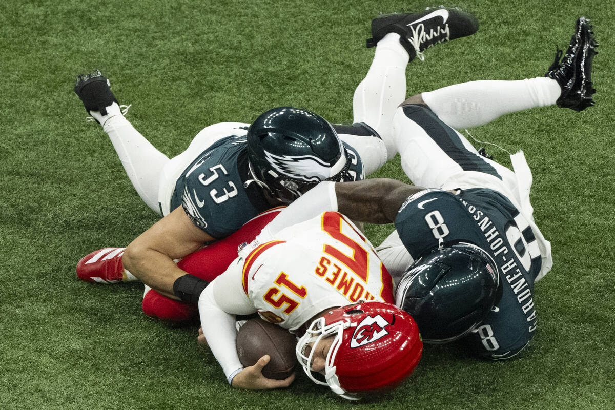 Kansas City Chiefs quarterback Patrick Mahomes (15) is tackled by Philadelphia Eagles linebacke ...