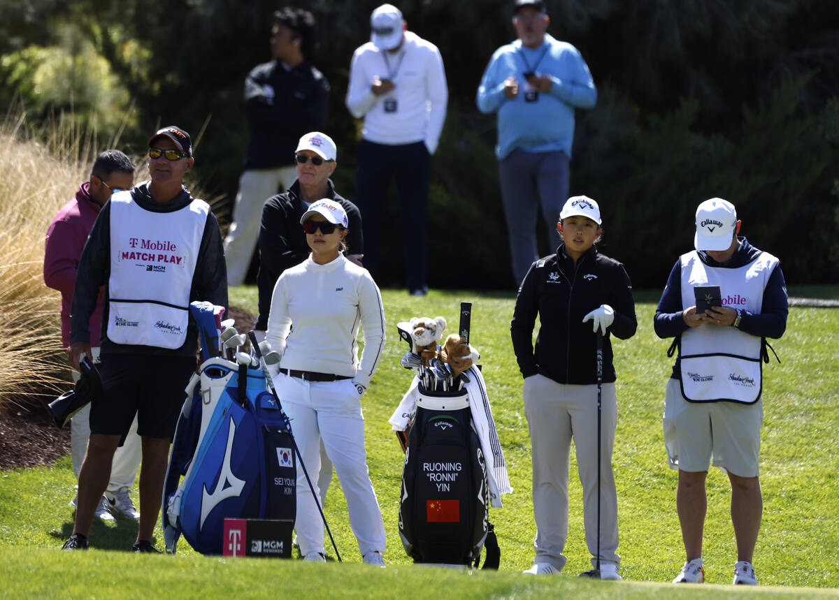 Sei Young Kim of Korea, second left, and Ruoning Yin of China, second right, wait for their tur ...