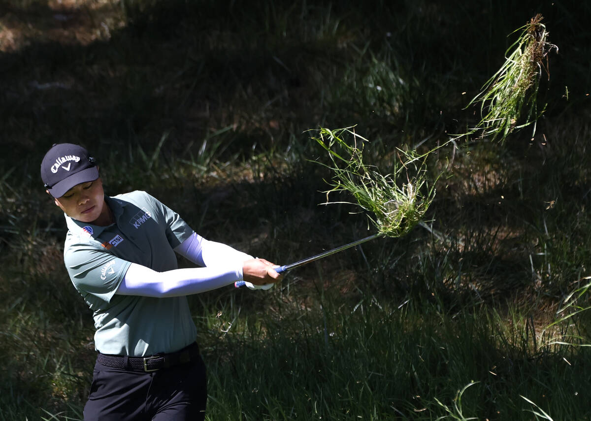 Yuka Saso of Japan chips from a fairway after her tee drive came to rest on grass during the th ...