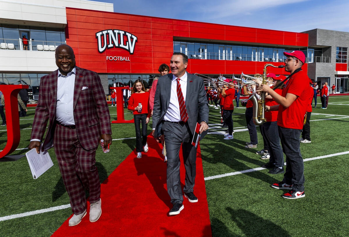 UNLV athletic director Erick Harper, left, arrives with Dan Mullen and his family as they intro ...