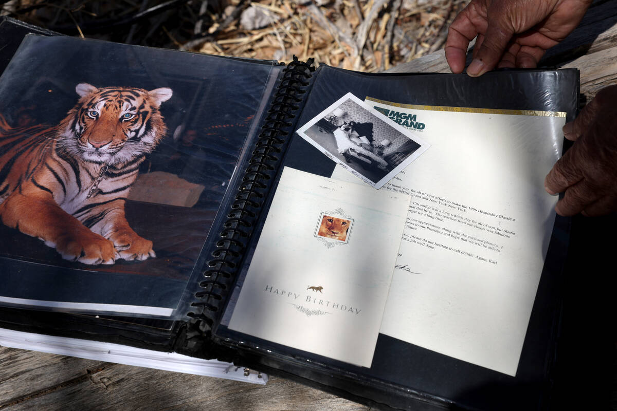 Karl Mitchell and Catherine Griffiths show photos of Mitchell’s career as a professional ...