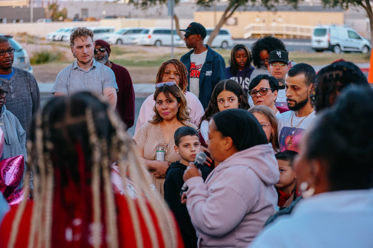 Attendees listen to three-year-old Journei Ross’ grandmother speak during a vigil commemorati ...