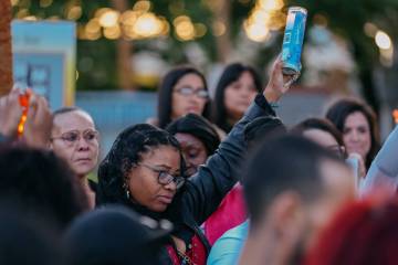 Phalan Whitson holds up a lit candle to commemorate the life of her three-year-old daughter, Jo ...