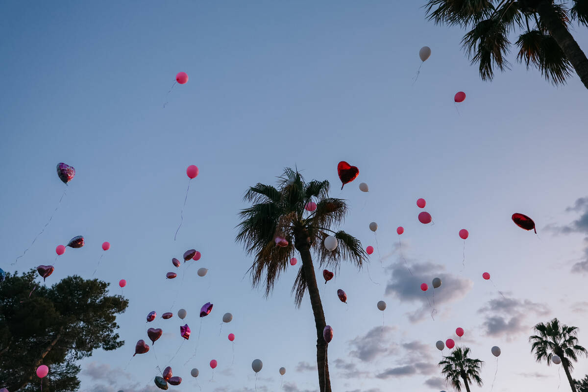 Balloons fill the air as they fly away during the vigil for three-year-old Journei Ross on Frid ...