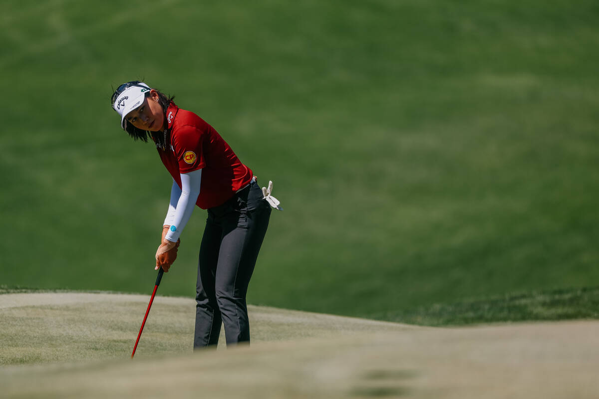 Jeeno Thitikul of Thailand squares up to try and make it further into the green at the second h ...