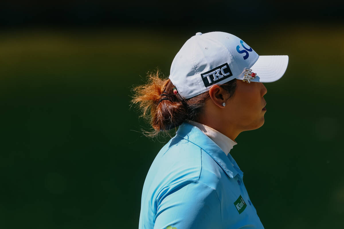 Ariya Jutanugarn of Thailand walks across the green at the fourth hole during her quarterfinal ...