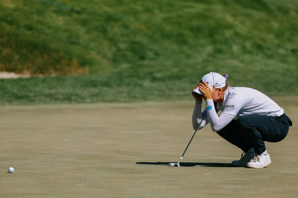 Stephanie Kyriacou of Australia visualizes her next move on the green of the ninth hole during ...