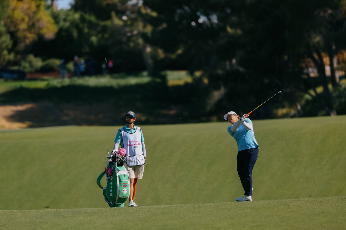 Ariya Jutanugarn of Thailand follows through on a swing form the fairway of the ninth hole duri ...