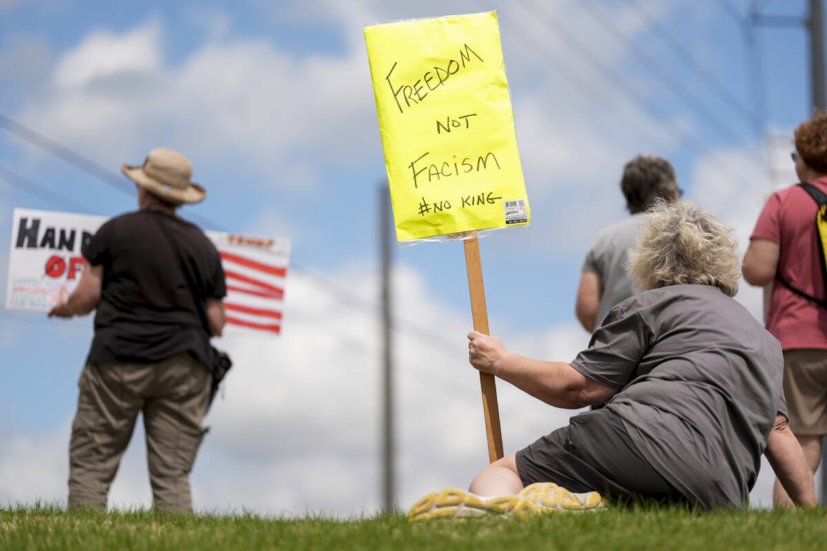 Beth Maddox, of Calhoun, Ga., right, participates in a civil rights demonstrators, Saturday, Ap ...