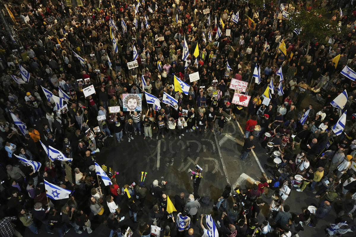 People take part in a protest demanding the immediate release of hostages held by Hamas in the ...