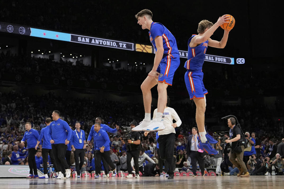 Florida forward Alex Condon and forward Thomas Haugh celebrate their win against Auburn in the ...