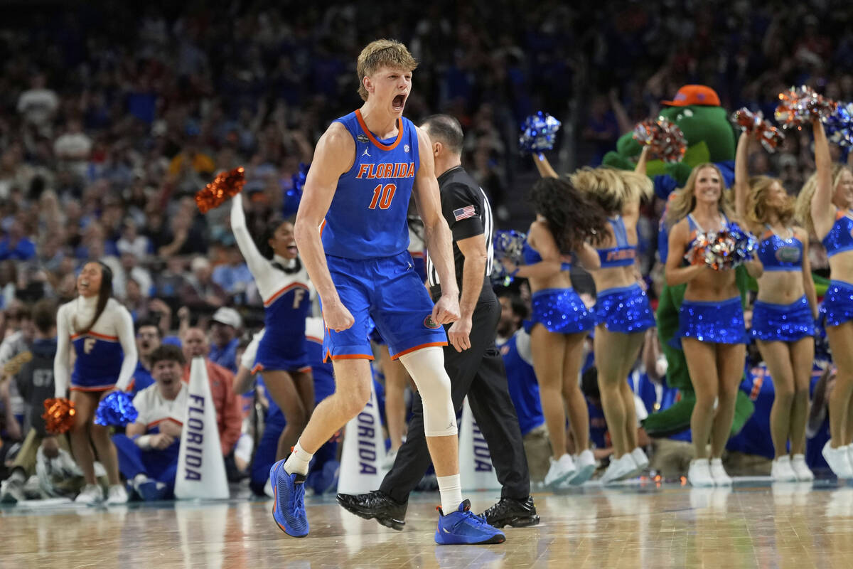 Florida's Thomas Haugh (10) celebrates after making a basket while being fouled against Auburn ...