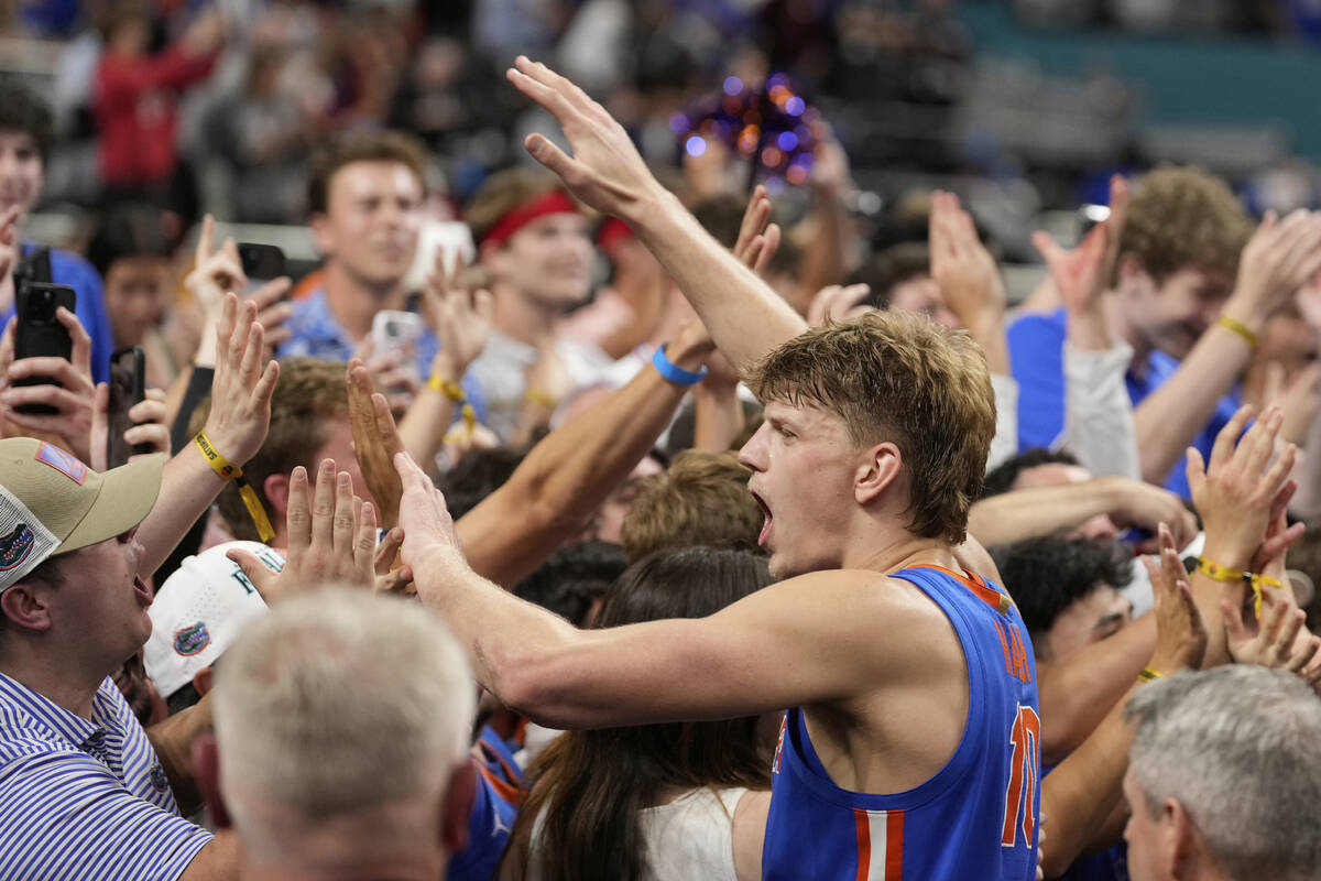 Florida forward Thomas Haugh celebrates after their win against Auburn during the second half i ...