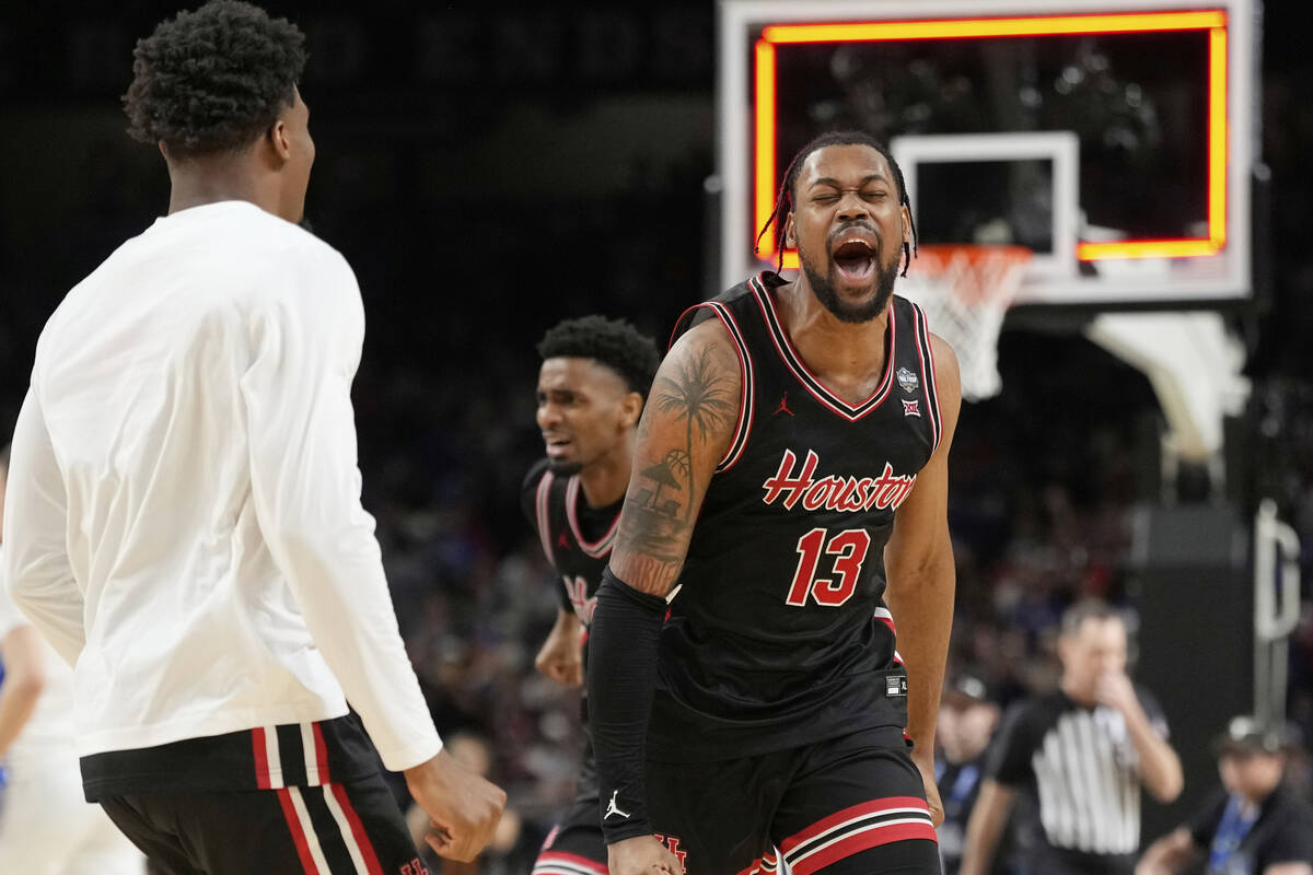 Houston's J'Wan Roberts (13) celebrates after Houston beat Duke in the national semifinals at t ...