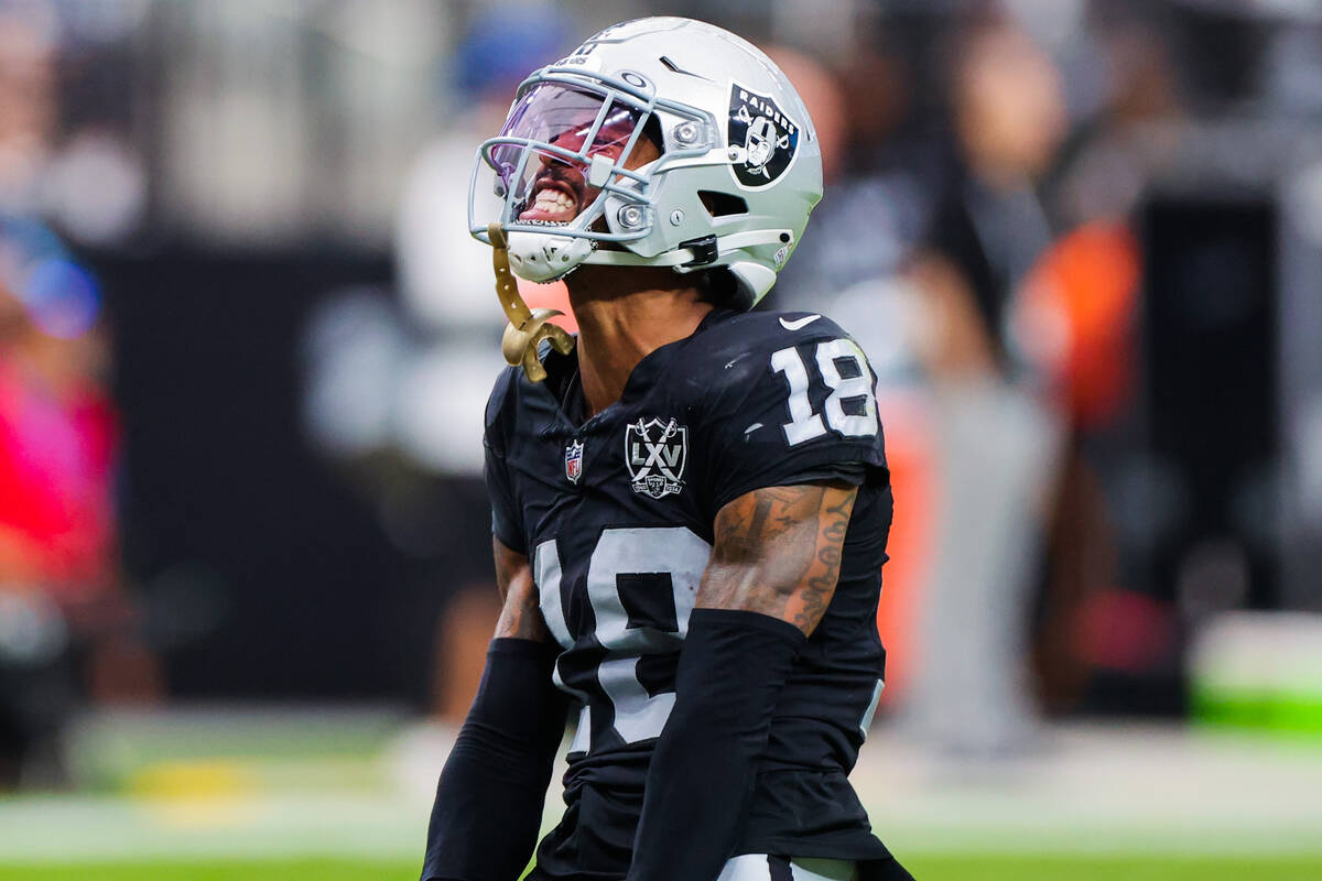 Raiders cornerback Jack Jones (18) pumps up the crowd during the first half of an NFL football ...
