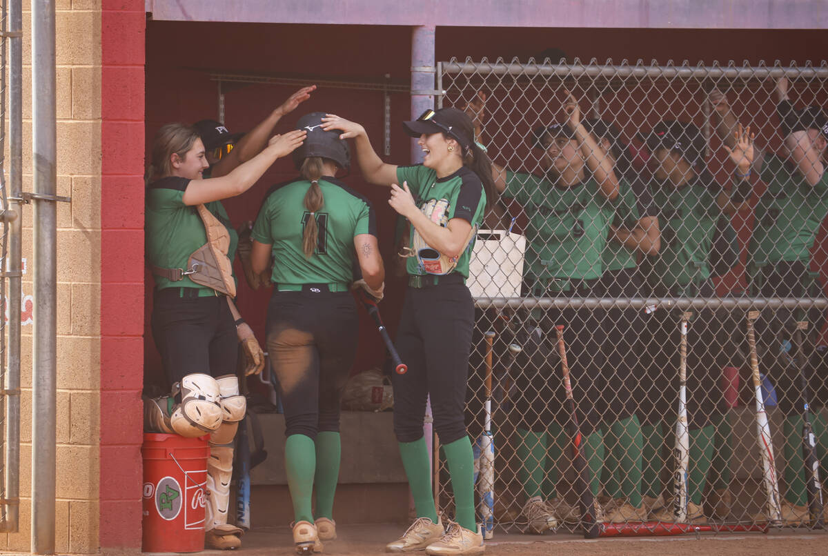 Palo Verde's Taylor Johns (11) celebrates her run with teammates during a softball game at Arbo ...