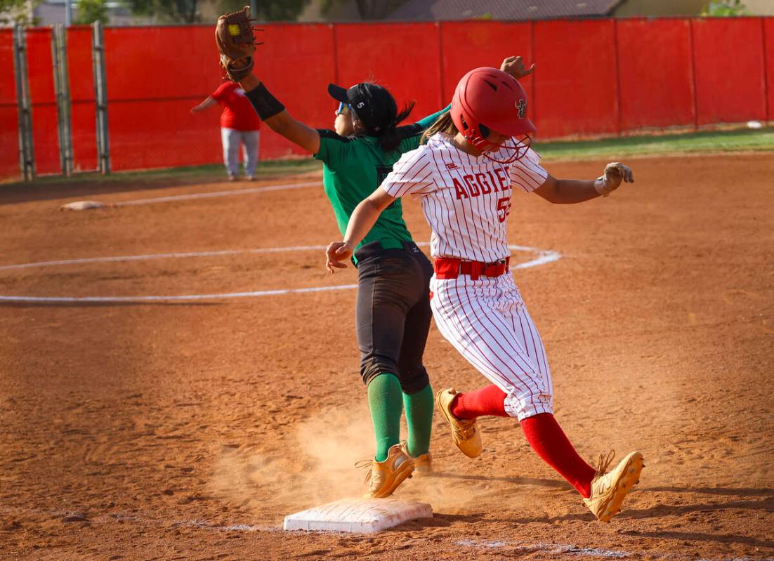 Arbor View's Lilly Easton (55) gets to first base against Palo Verde's Ava Cruz (5) during a so ...