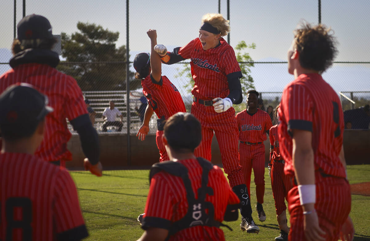 Las Vegas' Hunter Iverson, center right, celebrates his home run against Bishop Gorman during a ...