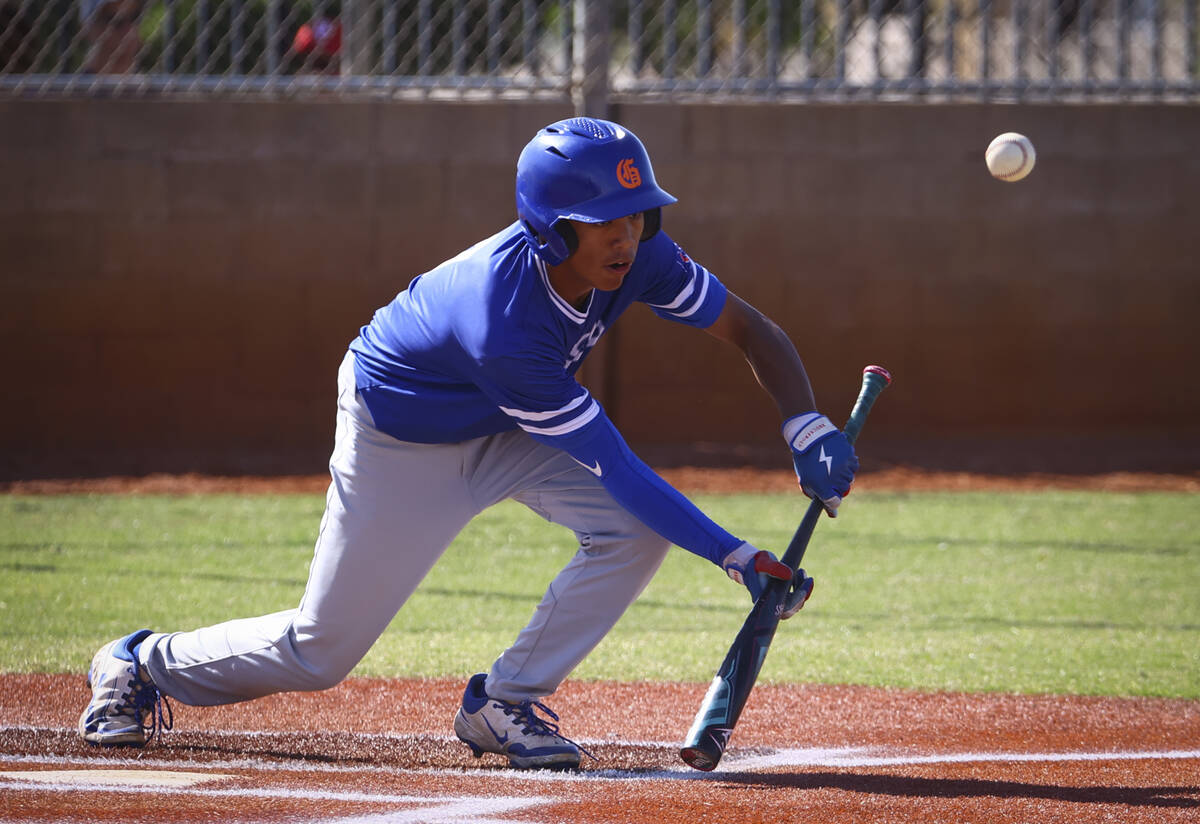 Bishop Gorman's Justin Rodrigues bunts the ball during a baseball game at Las Vegas High School ...