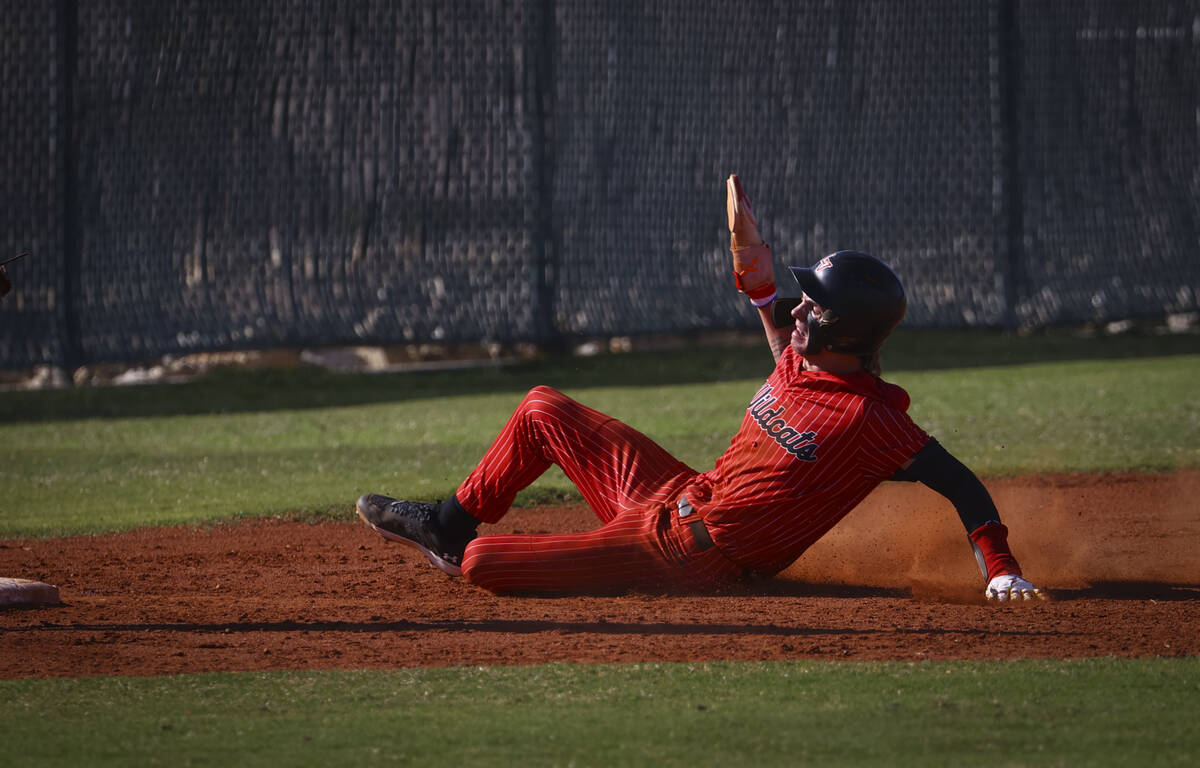 Las Vegas outfielder Bryden Bull slides into third base against Bishop Gorman during a baseball ...