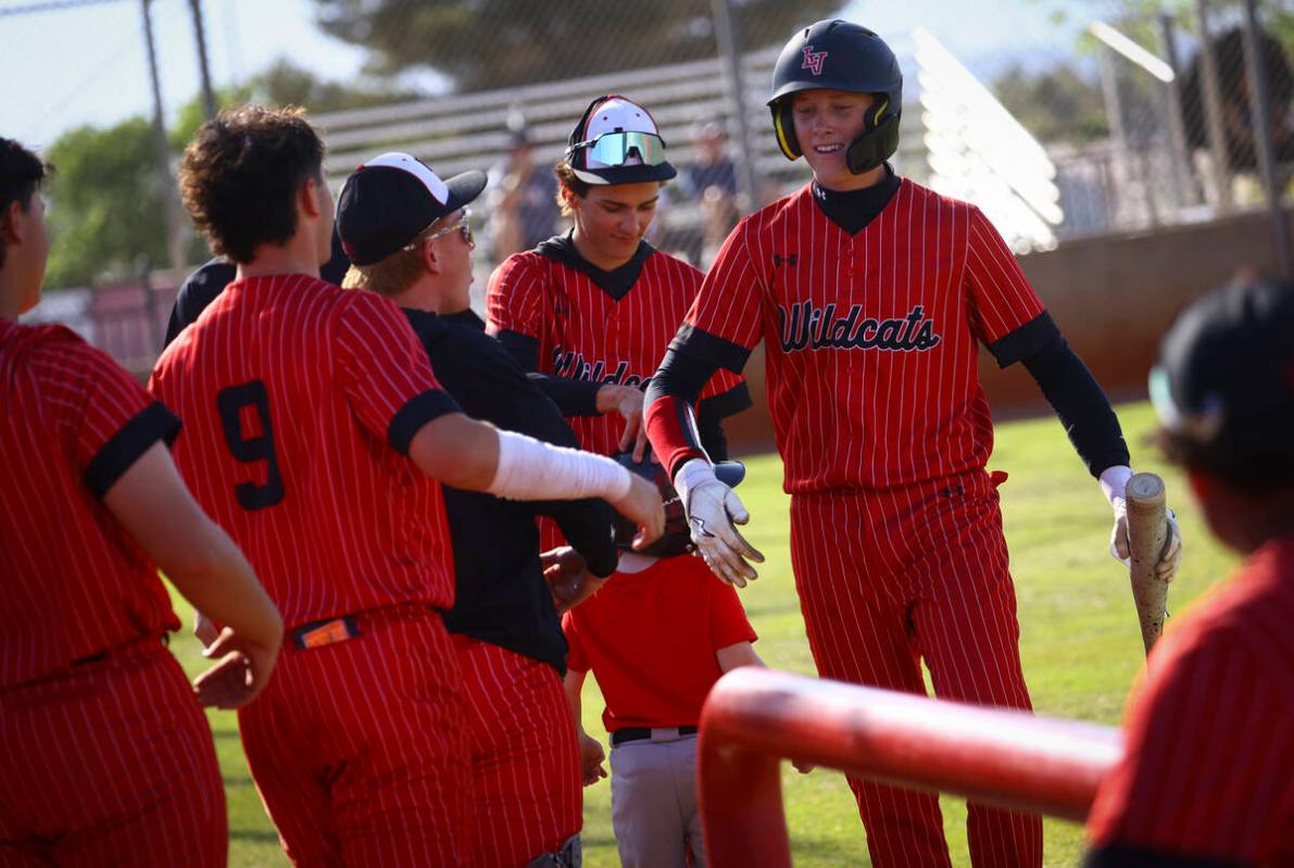 Las Vegas' Hunter Iverson, right, celebrates his run with teammates during a baseball game agai ...