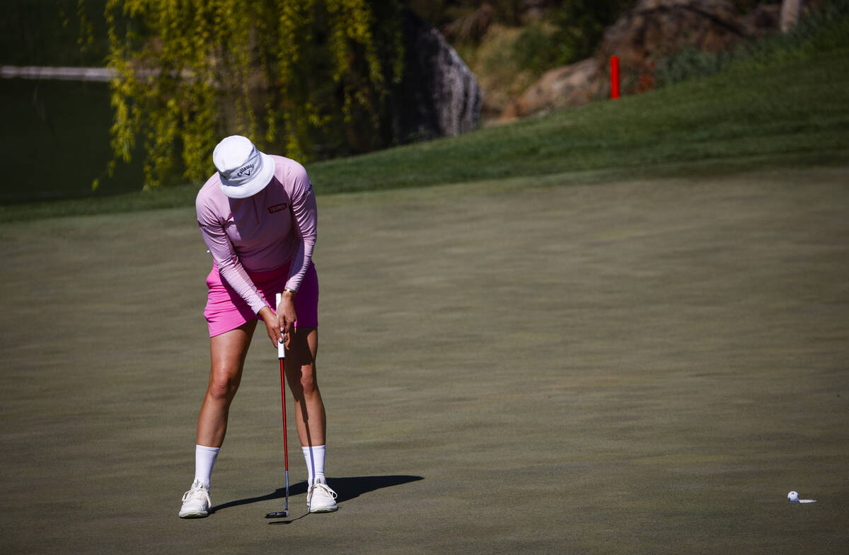 Madelene Sagstrom putts on the fourth green to win the hole against Lauren Coughlin during the ...