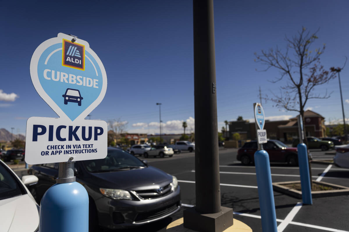 Curbside parking spots are seen outside of discount grocery store Aldi, slated to open later th ...