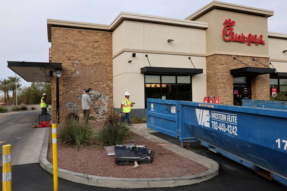 A smashed “do not enter” sign is seen as workers make preparations to repair a Ch ...