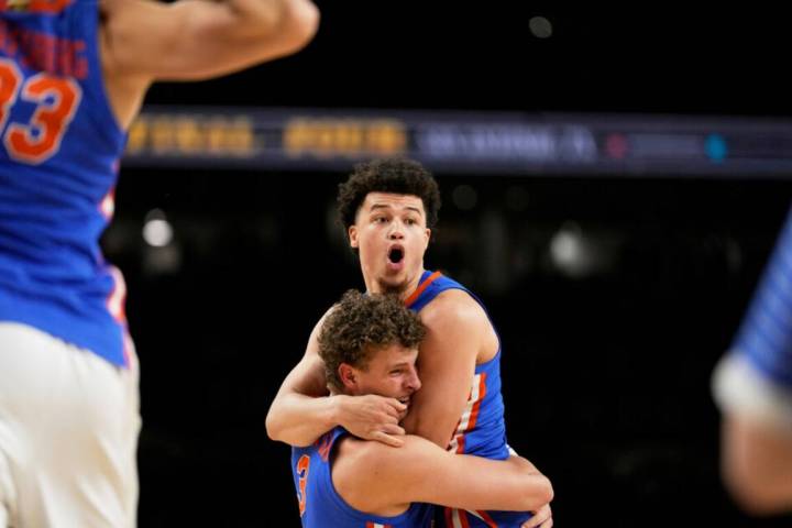 Florida guard Walter Clayton Jr. and center Micah Handlogten celebrates after their win against ...