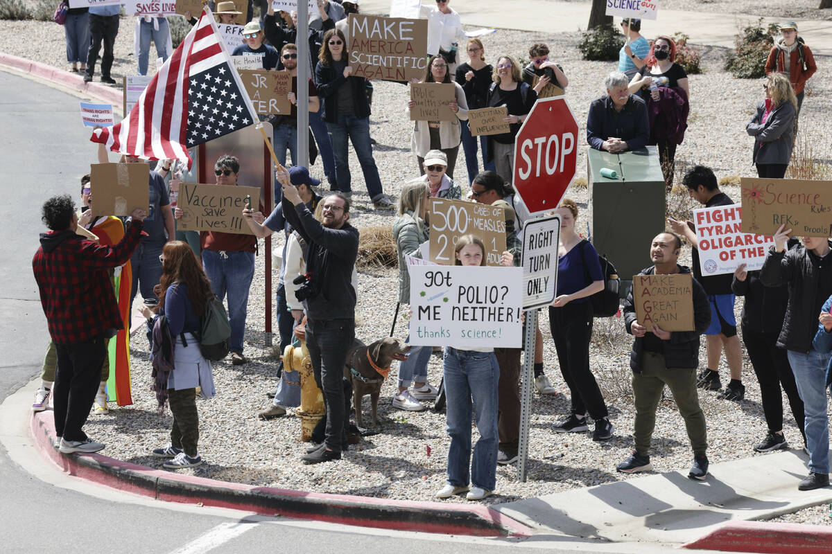 People protest before a press conference about Utah's new fluoride ban, food additives and SNAP ...