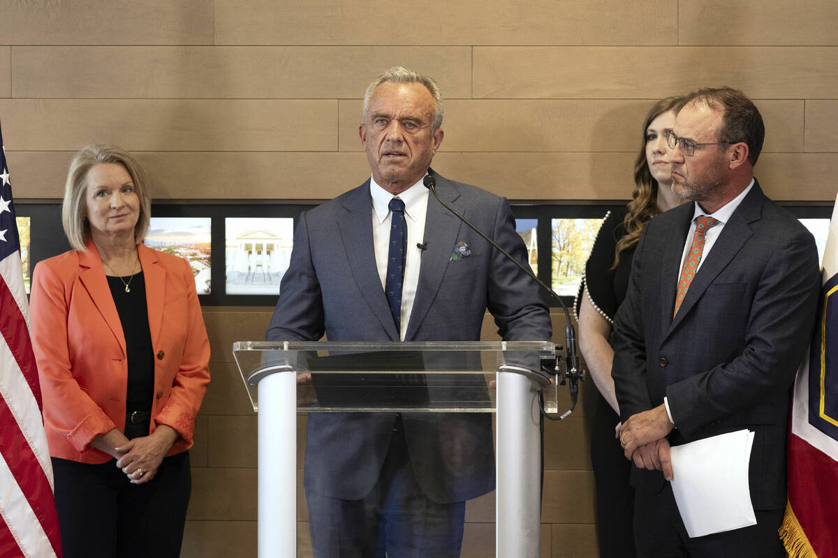 Health and Human Services Secretary Robert F. Kennedy Jr., center, speaks during a press confer ...