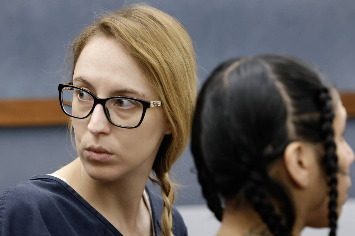 Victoria Goodwin, accused of plotting to kill her reality star husband, listens to her attorney ...