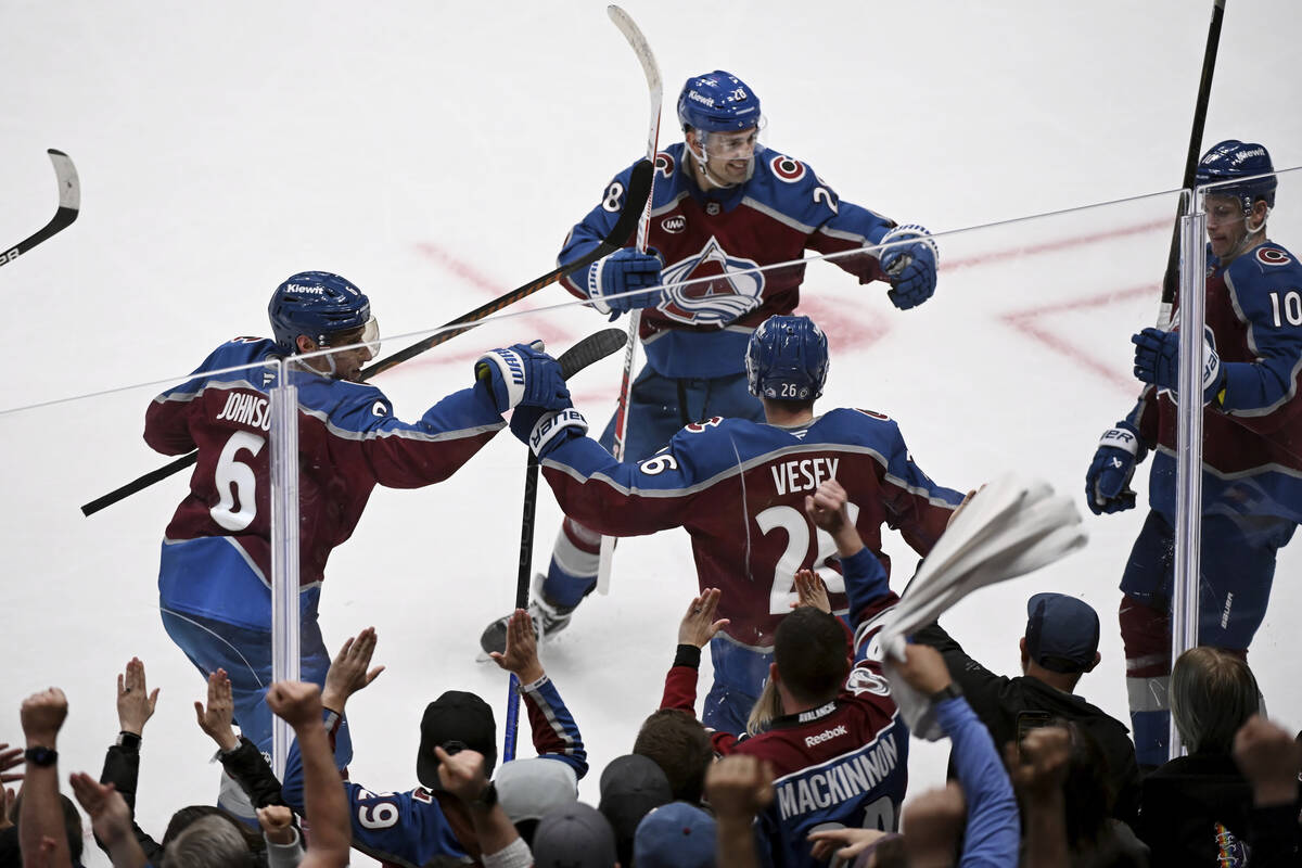 Colorado Avalanche defenseman Erik Johnson (6), left wing Miles Wood (28), left wing Jimmy Vese ...