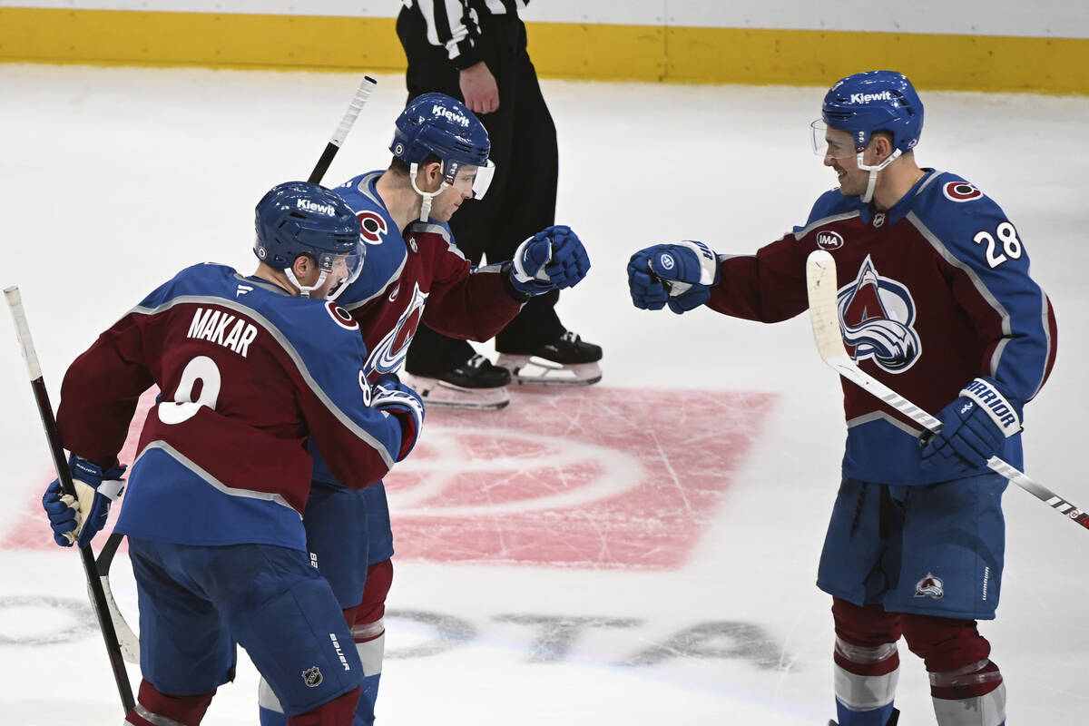 Colorado Avalanche defenseman Cale Makar (8), center Charlie Coyle (10) and left wing Miles Woo ...