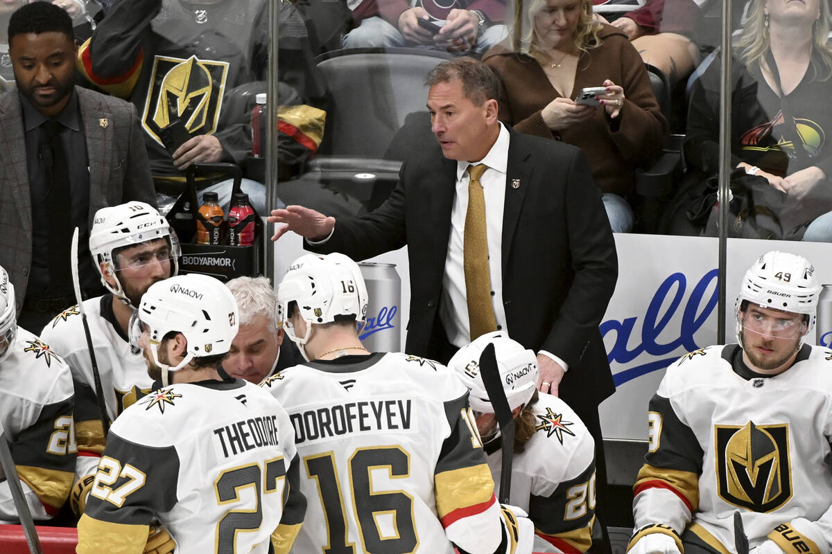 Vegas Golden Knights head coach Bruce Cassidy, middle, talks to his team during a pause in over ...