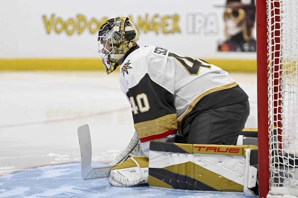 Vegas Golden Knights goaltender Akira Schmid (40) stretches prior to an NHL hockey game against ...