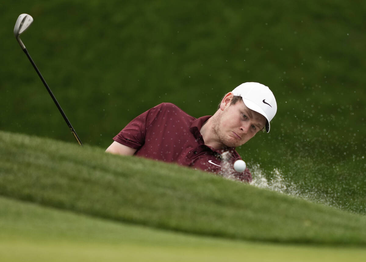 Robert MacIntyre, of Scotland, hits from the sand on the second hole during the final round of ...