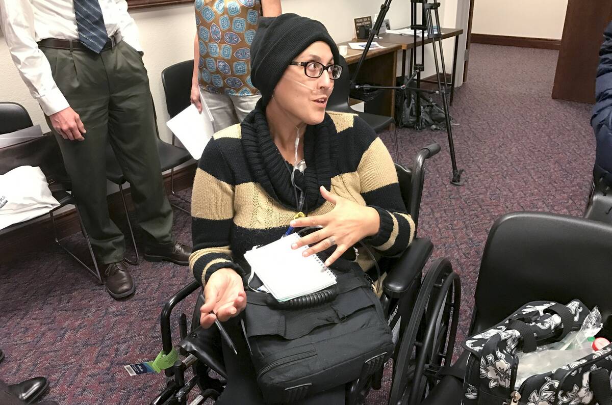 Stephanie Packer, a 34-year-old mother of four, talks with reporters after a press conference W ...