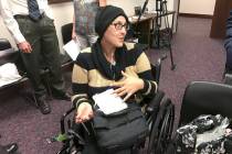 Stephanie Packer, a 34-year-old mother of four, talks with reporters after a press conference W ...