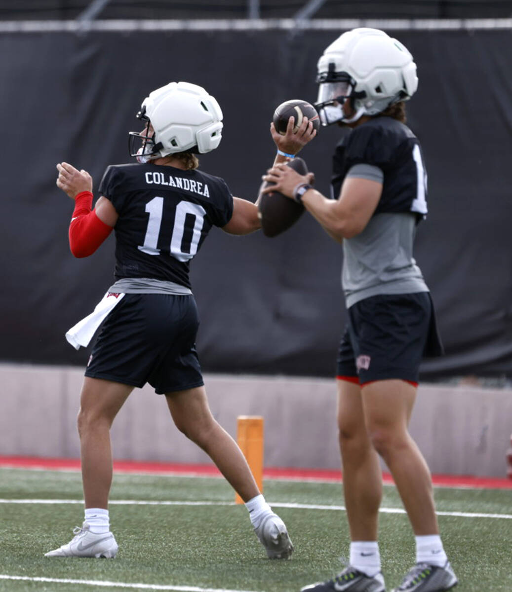 UNLV quarterbacks Anthony Colandrea (10) and Gael Ochoa (14) prepares to throw the ball on duri ...