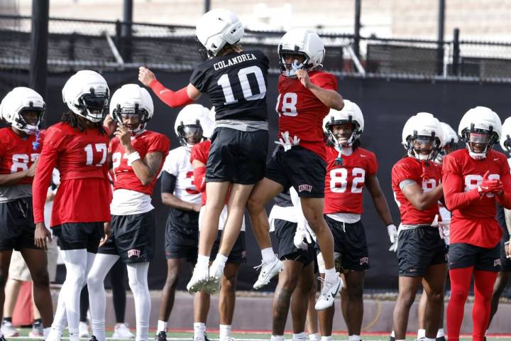 UNLV quarterback Anthony Colandrea (10) and wide receiver DeAngelo Irvin Jr. react as they prep ...